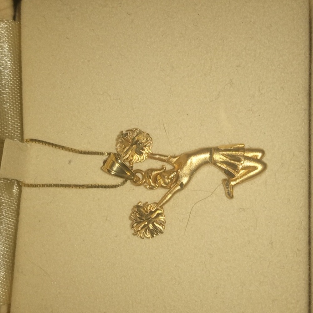 Zale's gold Cheerleader pendant